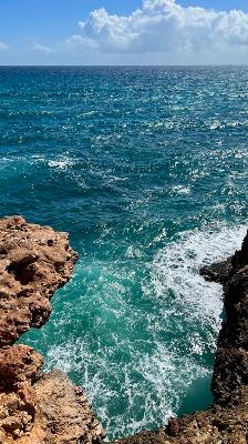 I remember being on this cliff and feeling like the world stopped for a minute, soaking it all in and accepting that this was the most beautiful sight in the world, the water was a beautiful shade of turquoise and blue. In the moment I recall feeling at peace and looking around to endless ocean.